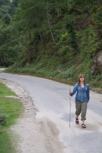 Layla, tired of the bus, now walking to Paro.