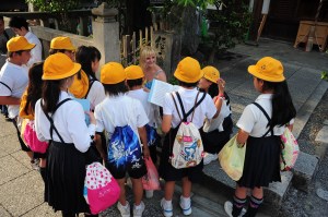 Layla surrounded by students.