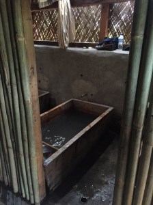 The baths made of wood; hot rocks dropped into one end...