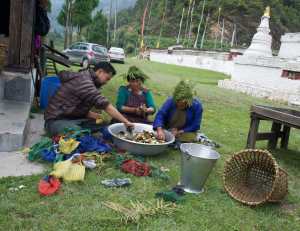 Cleaning butter lamps at the temple.