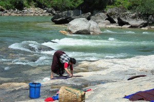 Washing clothes along the river in Bumthang.