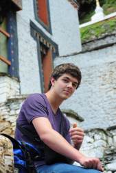 Sitting on the steps of Kurjey Lhakang in CHamkar Bhutan